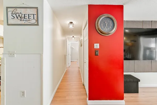 a view of a hallway with washer and dryer