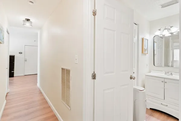 a view of a bathroom with a shower and a sink