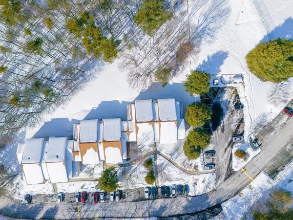 a aerial view of a house with swimming pool and patio