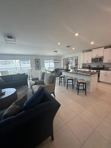 a living room with furniture and a window