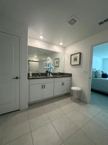 a bathroom with a glass shower door
