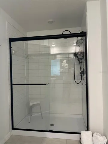 a bathroom with a granite countertop sink a toilet and a mirror