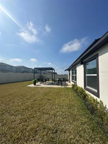 a house with trees in the background