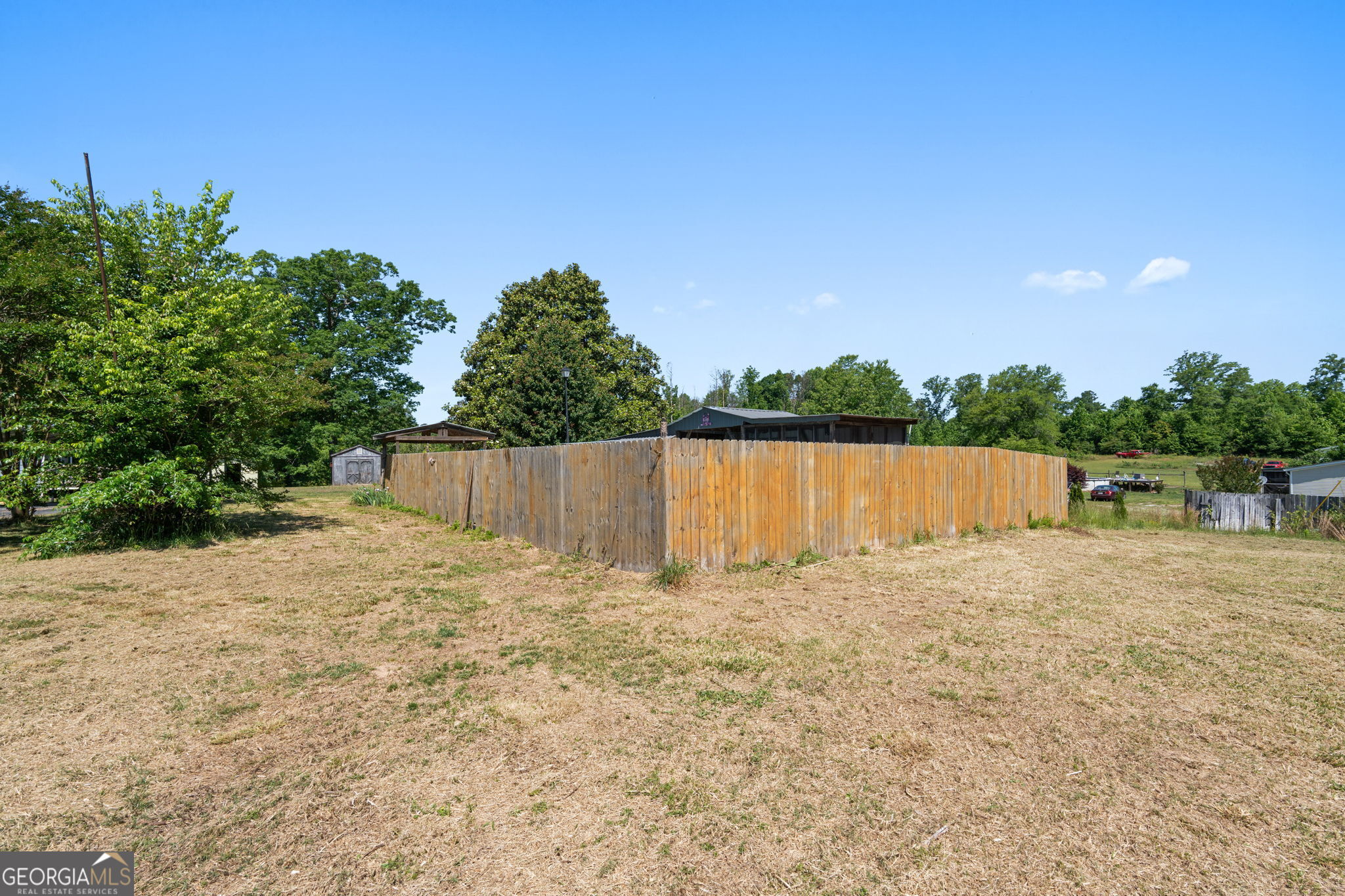 49 Frost Road Bowdon, GA 30108 - Photo 46 of 60 a backyard of a house with lots of green space