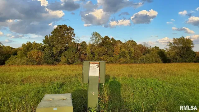 a view of a lake with a yard