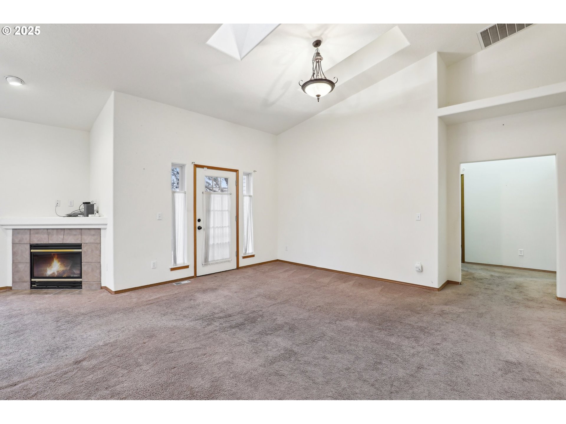 18222 Davis Street Sandy, OR 97055 - Photo 11 of 42 a view of empty room with a fireplace