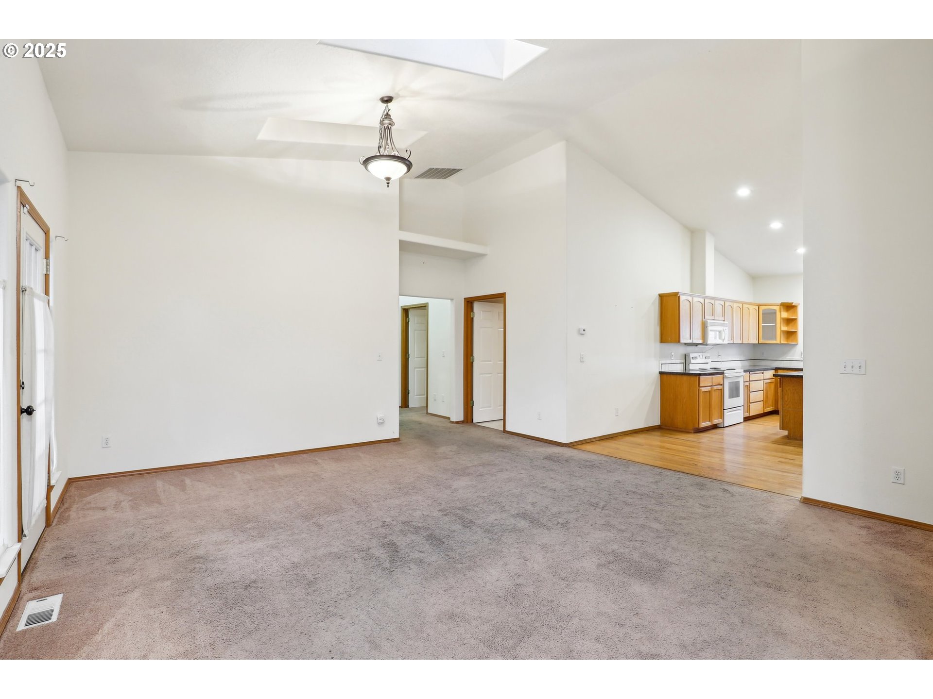 18222 Davis Street Sandy, OR 97055 - Photo 12 of 42 a view of empty room with wooden floor and windows