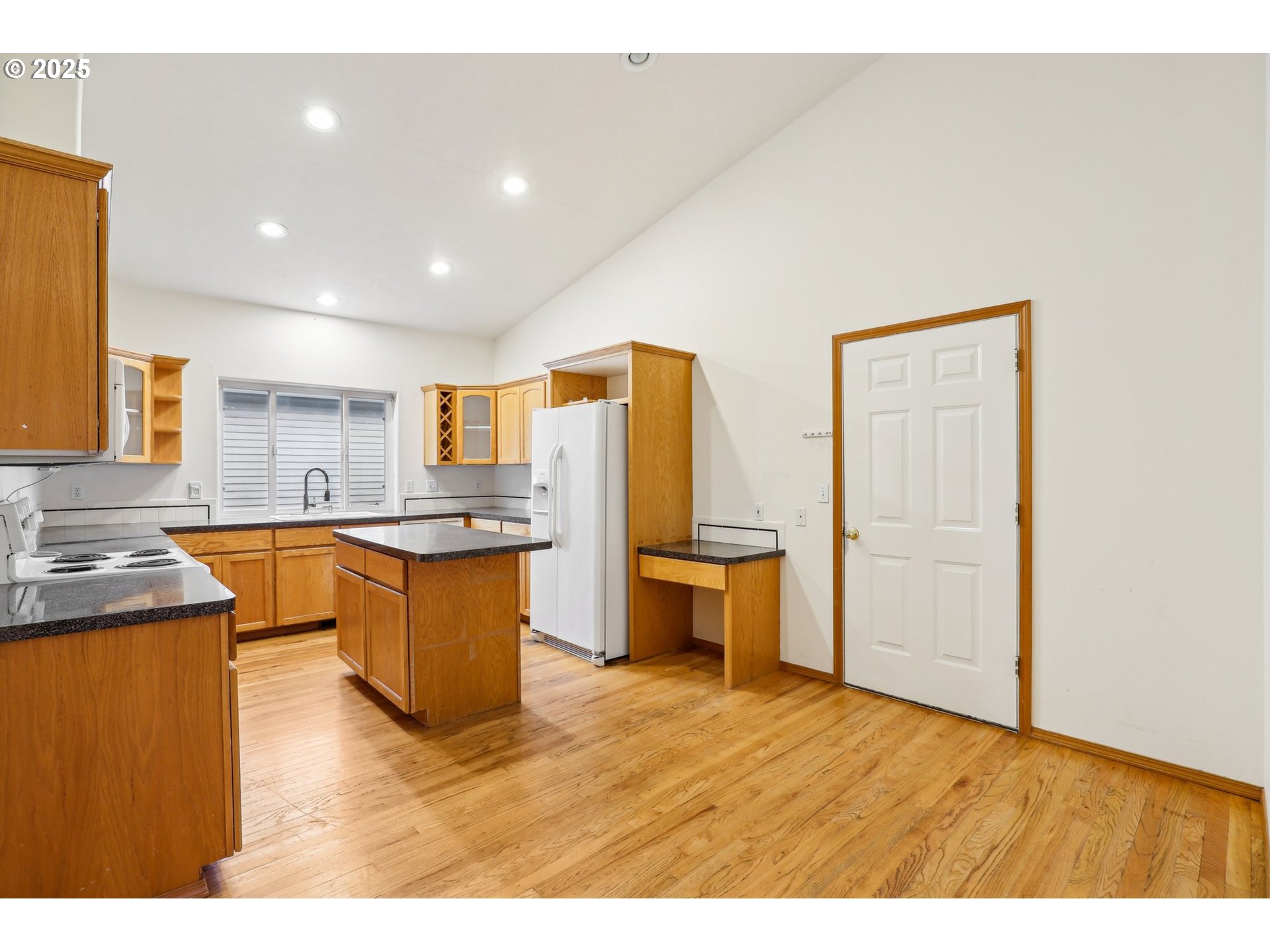18222 Davis Street Sandy, OR 97055 - Photo 14 of 42 a kitchen with stainless steel appliances granite countertop a granite counter tops and a view of living room
