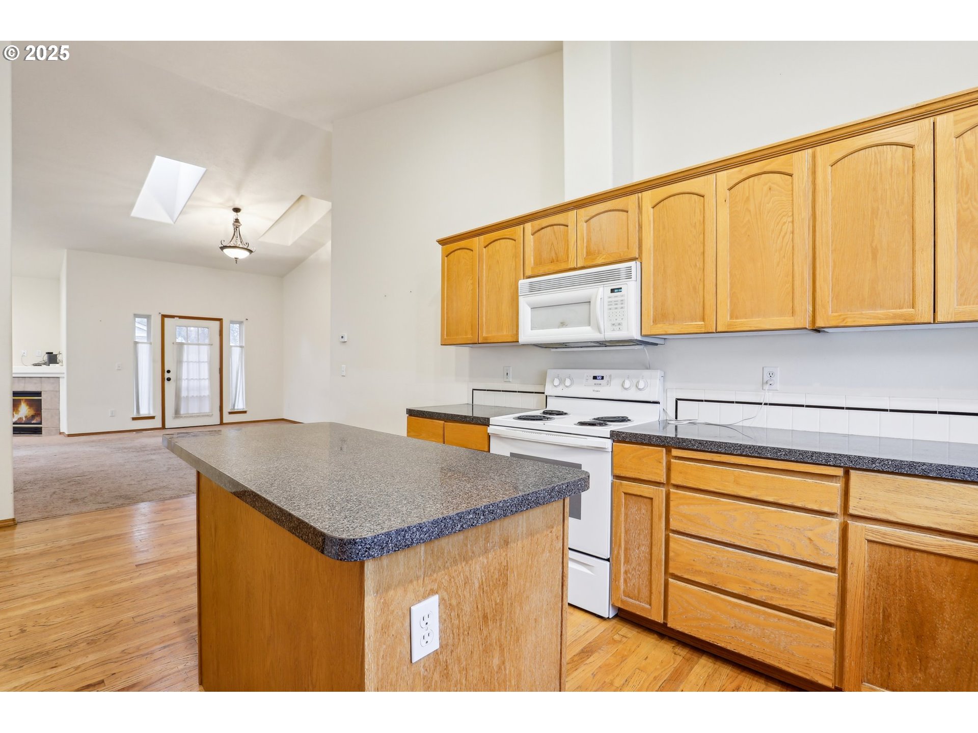 18222 Davis Street Sandy, OR 97055 - Photo 18 of 42 a kitchen with stainless steel appliances granite countertop a sink stove and cabinets
