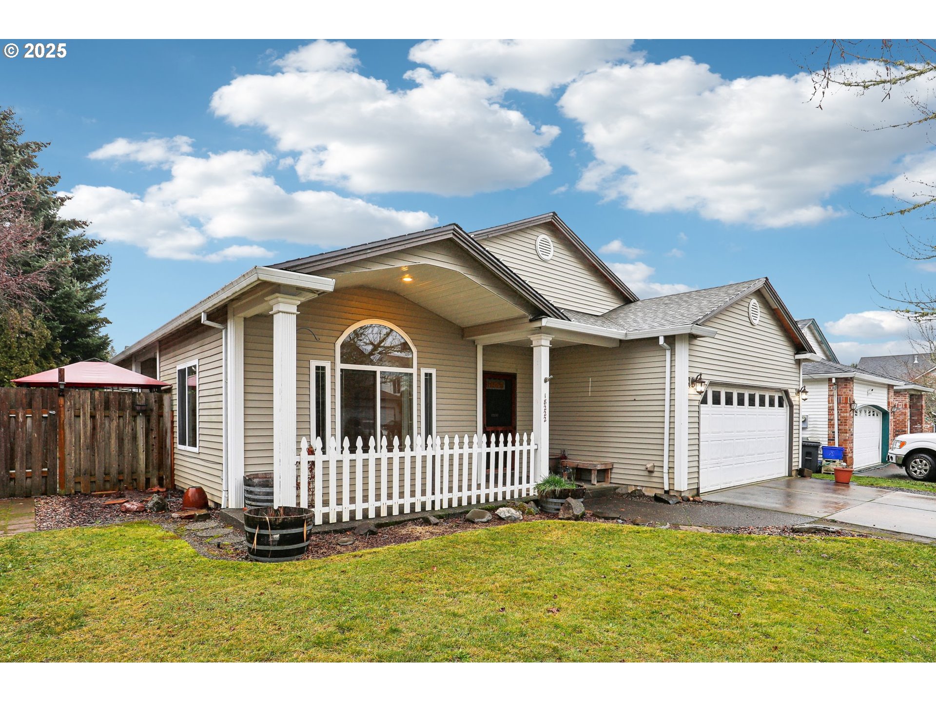 18222 Davis Street Sandy, OR 97055 - Photo 2 of 42 a view of a house with a big yard and large tree