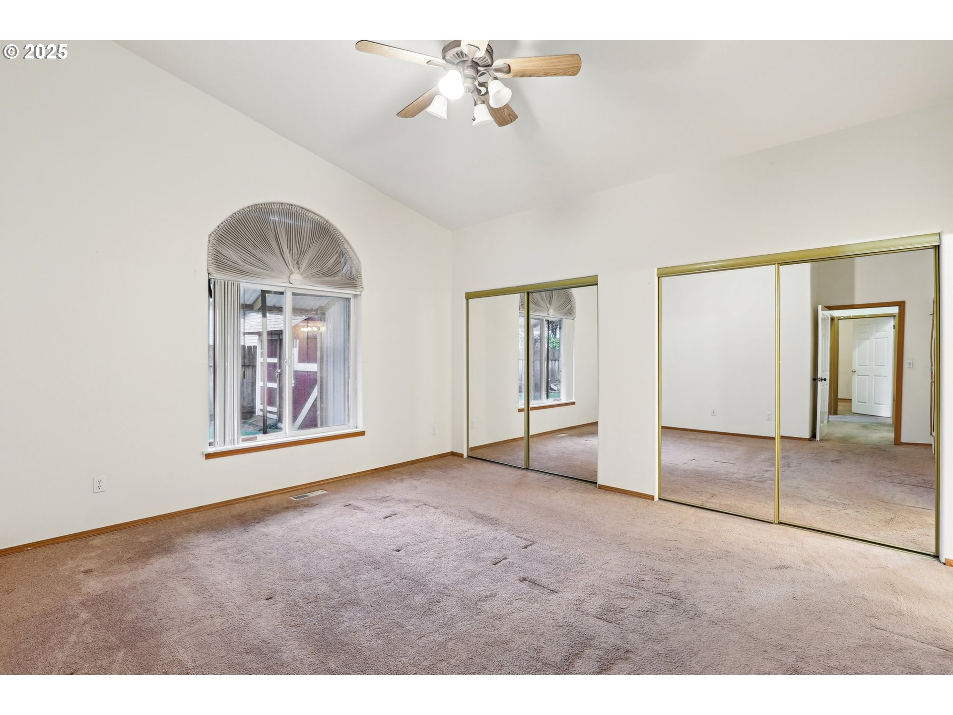 18222 Davis Street Sandy, OR 97055 - Photo 26 of 42 an empty room with chandelier fan and windows