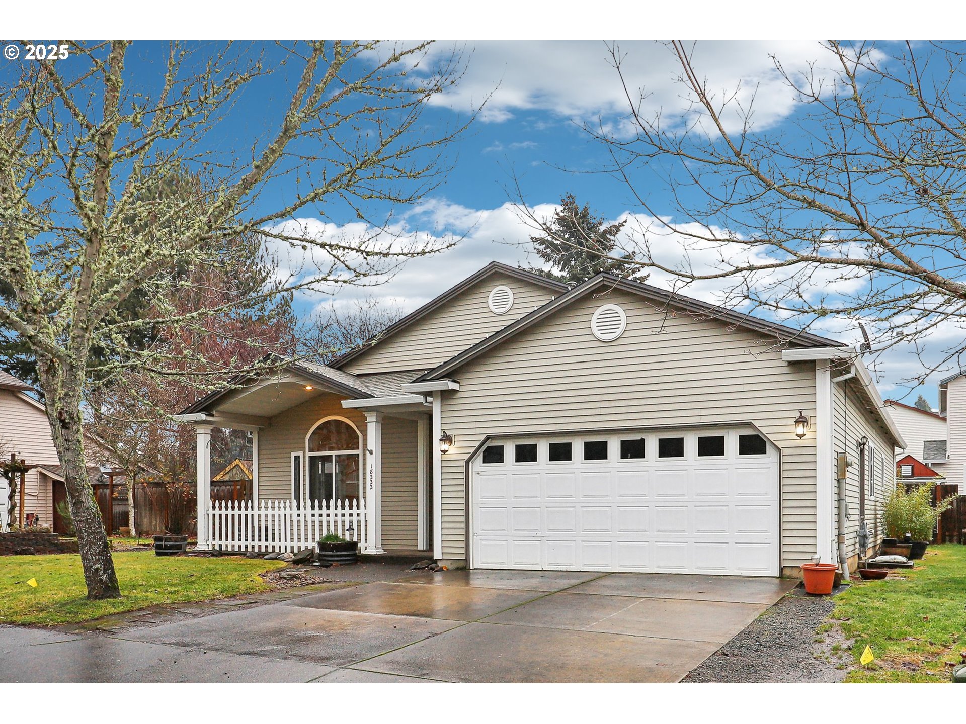 18222 Davis Street Sandy, OR 97055 - Photo 3 of 42 a view of a white house next to a yard with big trees