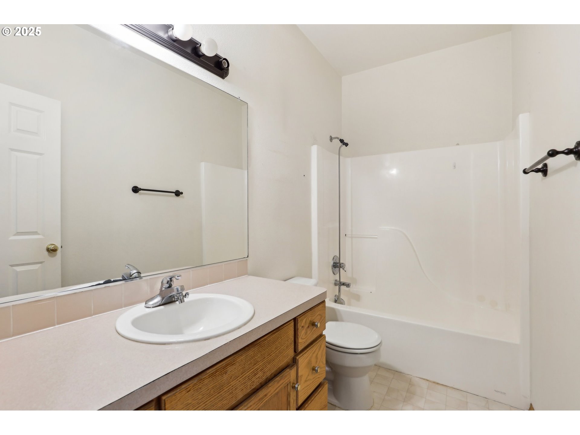 18222 Davis Street Sandy, OR 97055 - Photo 32 of 42 a bathroom with a sink a toilet a mirror and shower