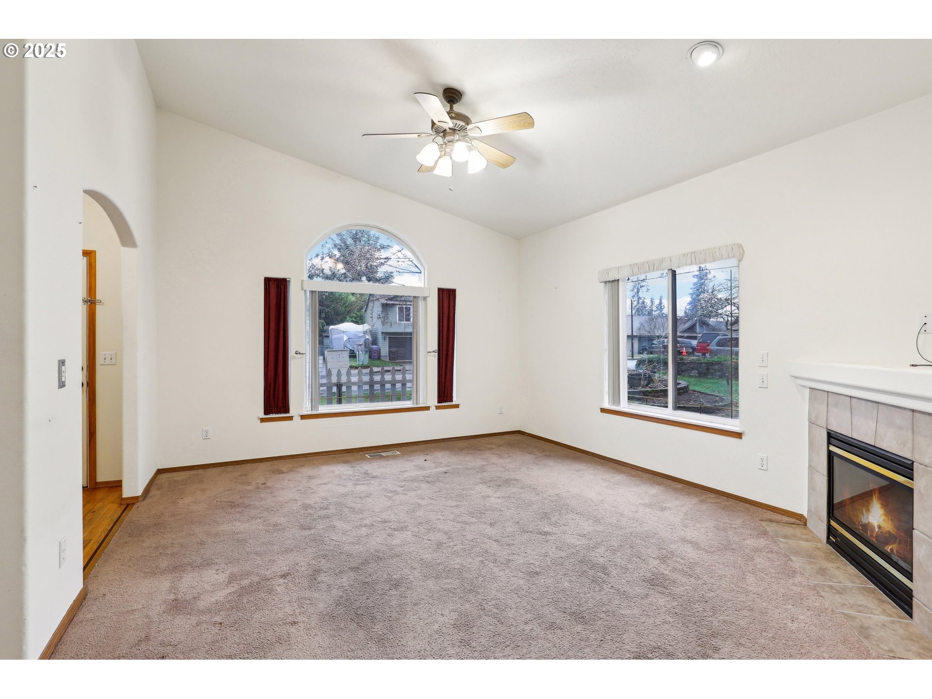 18222 Davis Street Sandy, OR 97055 - Photo 10 of 42 a view of livingroom with window fireplace and fan