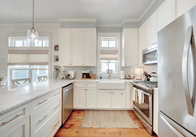 a kitchen with a sink stove and refrigerator