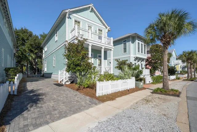 a view of a front of house with potted plants