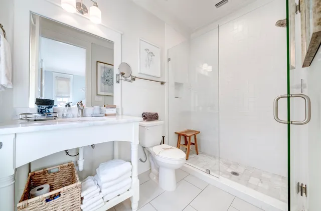 a bathroom with a sink toilet and shower