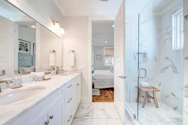 a spacious bathroom with a double vanity sink mirror and double