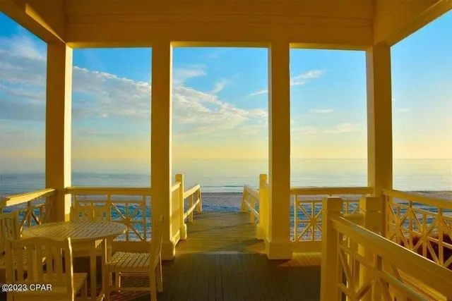 a view of a chairs and table on the deck