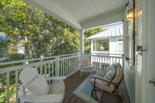 a view of a chair and table in the balcony