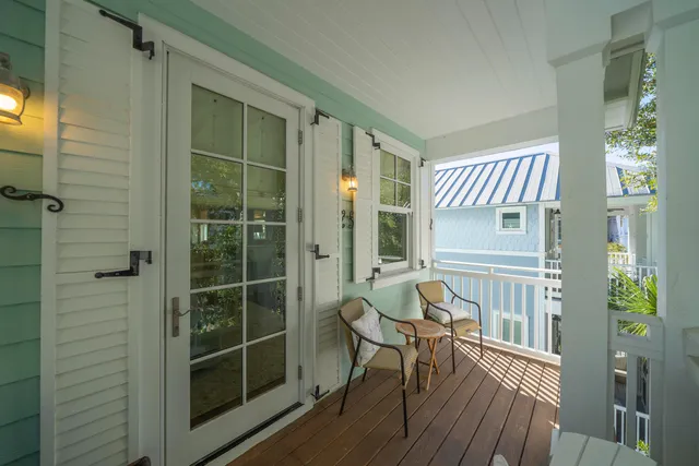 a view of a balcony with furniture