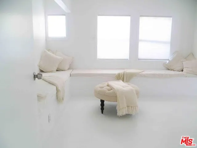 a bathroom with a bathtub and a table