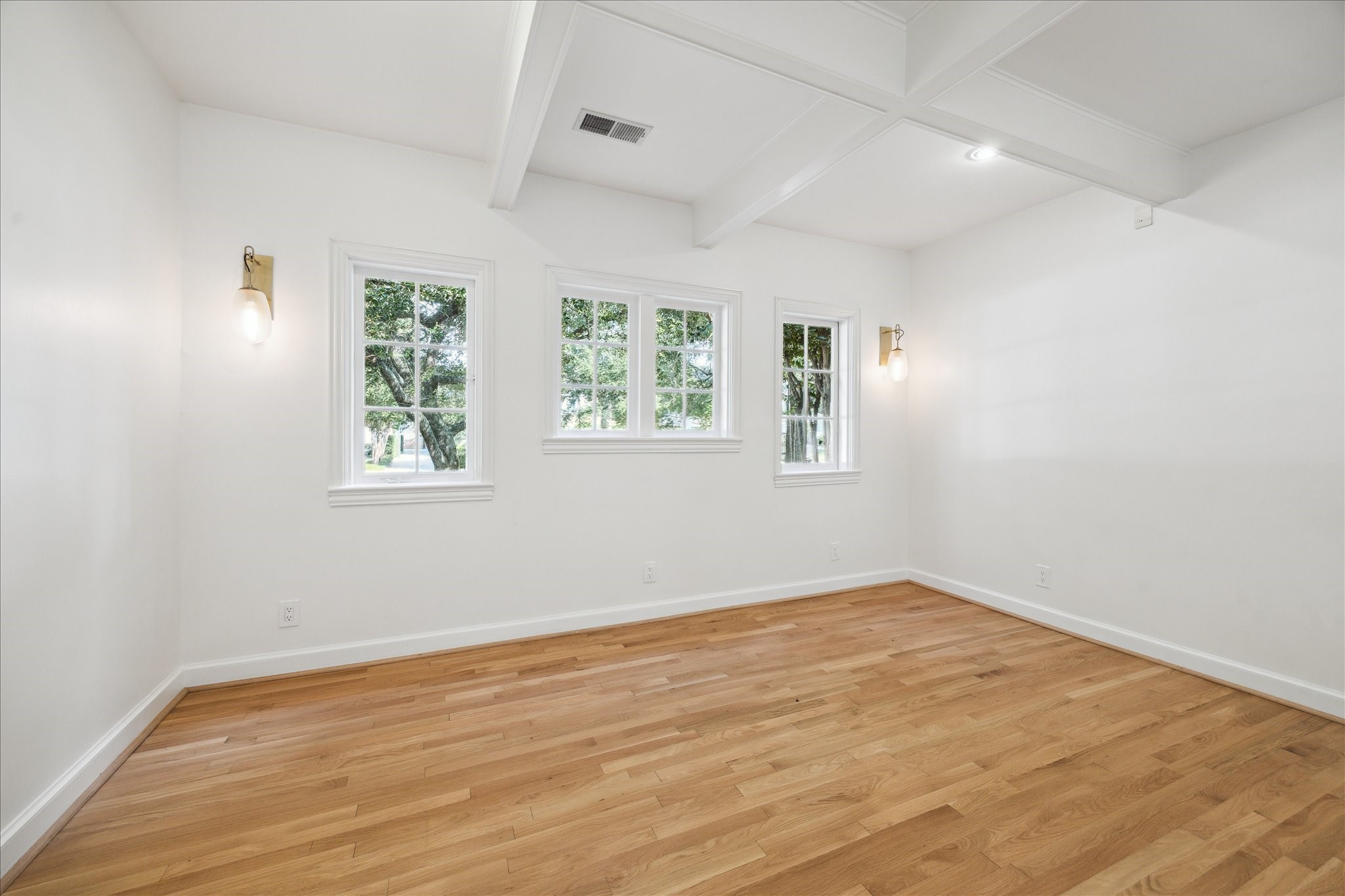 2117 Chilton Road Houston, TX 77019 - Photo 14 of 50 an empty room with wooden floor and windows