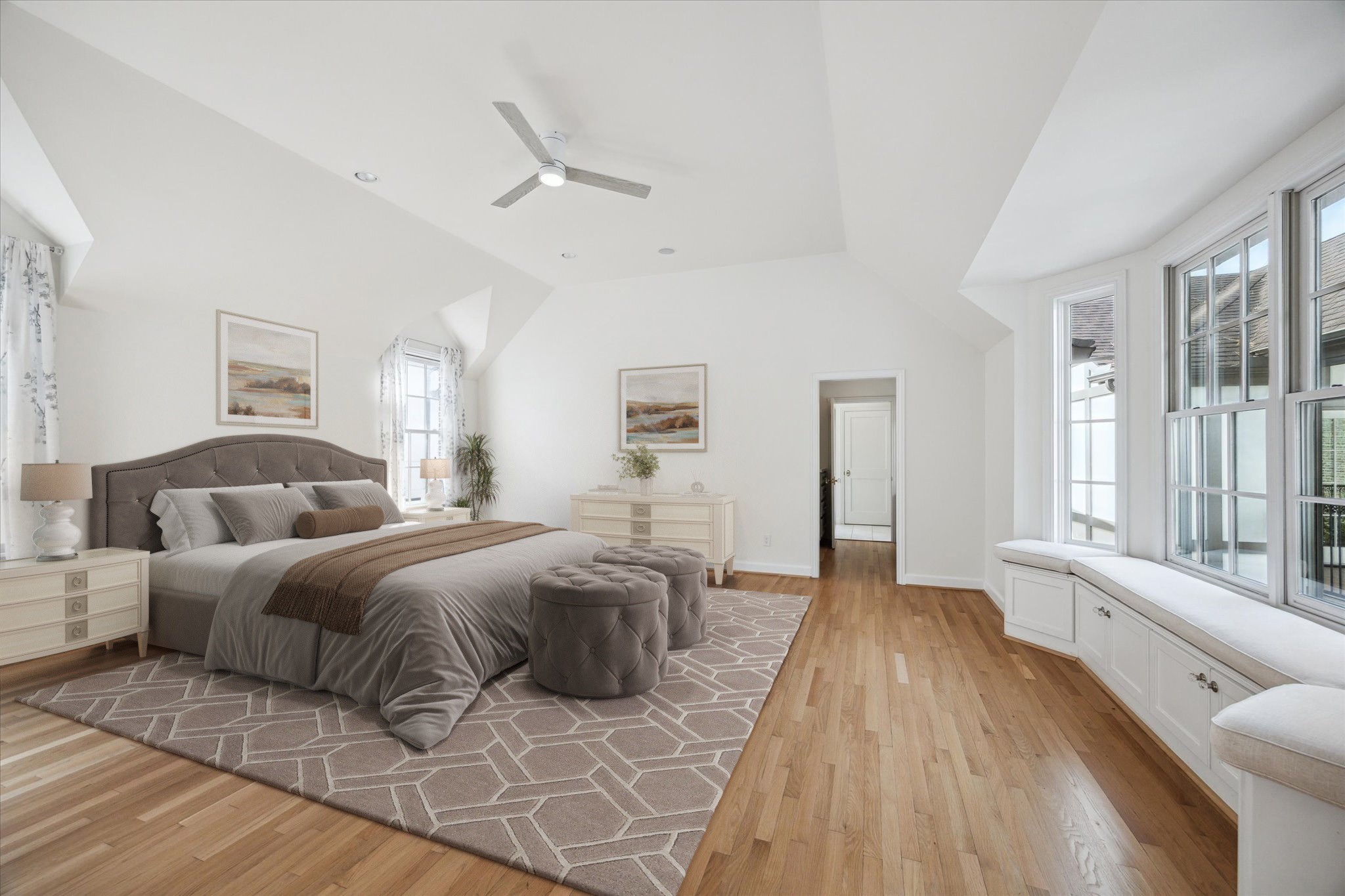 2117 Chilton Road Houston, TX 77019 - Photo 25 of 50 a spacious bedroom with a large bed and a wooden floor