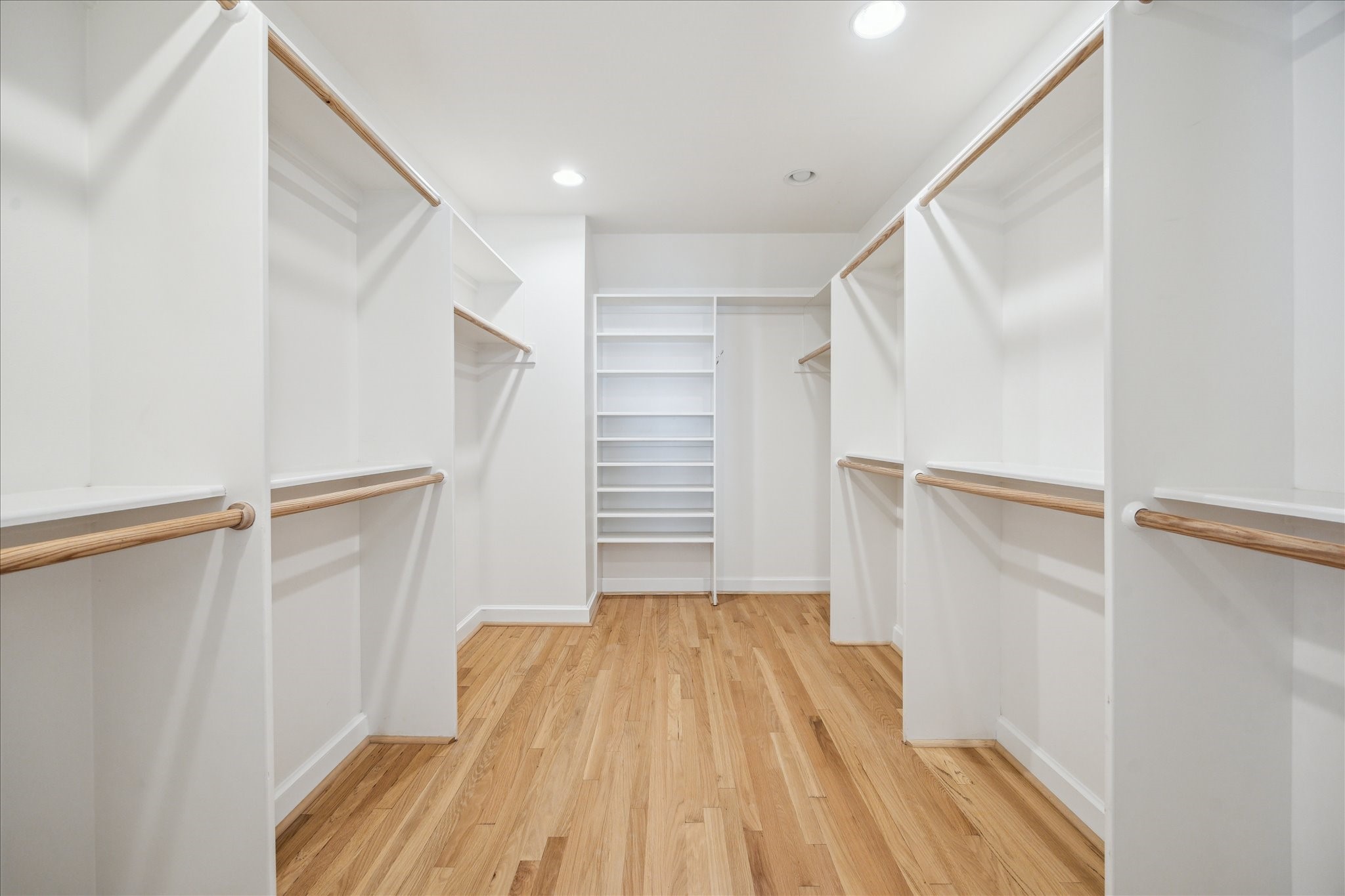 2117 Chilton Road Houston, TX 77019 - Photo 28 of 50 a view of walk in closet with empty racks