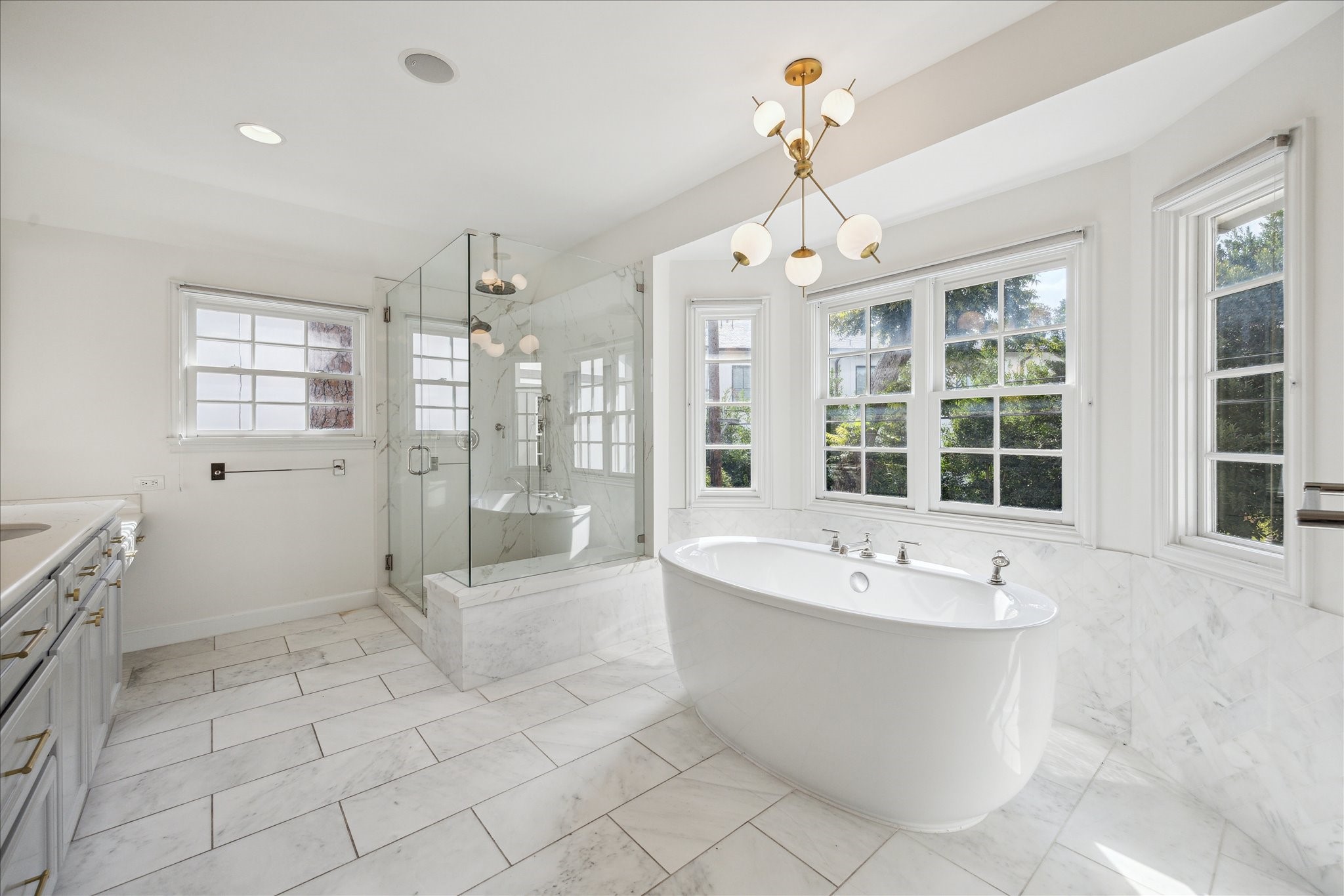 2117 Chilton Road Houston, TX 77019 - Photo 29 of 50 a large spacious bathroom with a tub shower and sink