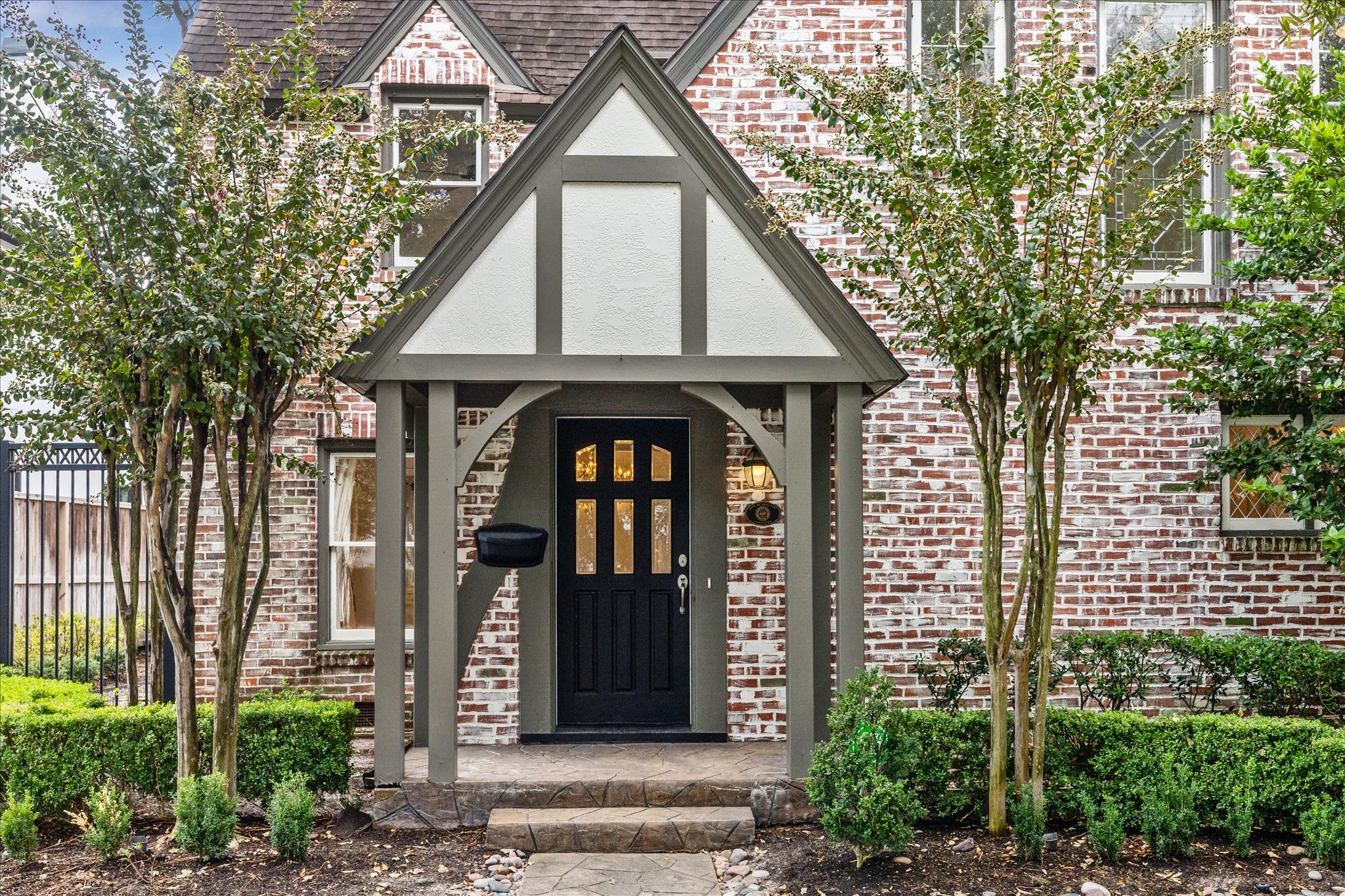 2117 Chilton Road Houston, TX 77019 - Photo 3 of 50 a front view of a house with garden