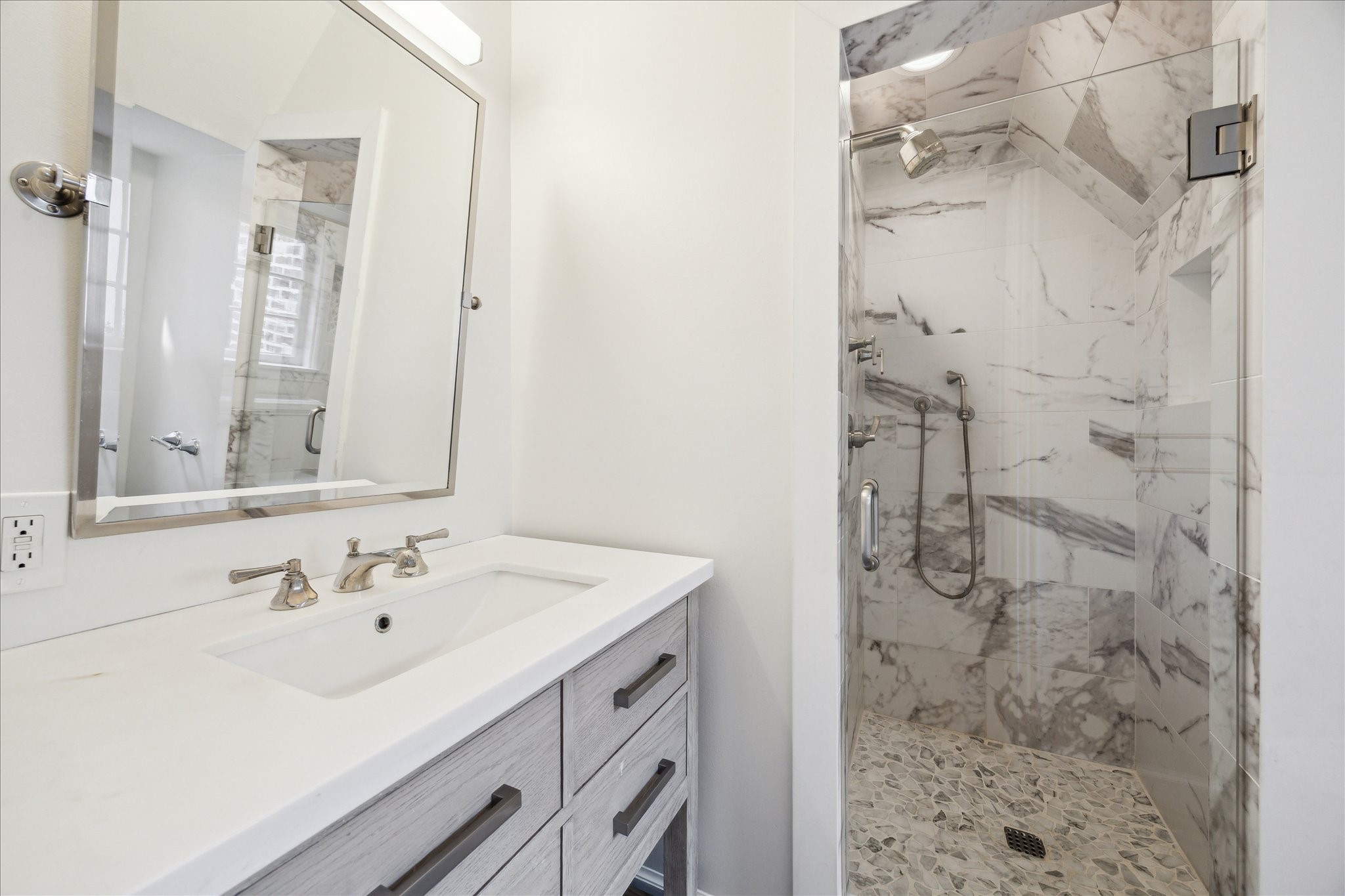 2117 Chilton Road Houston, TX 77019 - Photo 32 of 50 a bathroom with a sink shower and a mirror