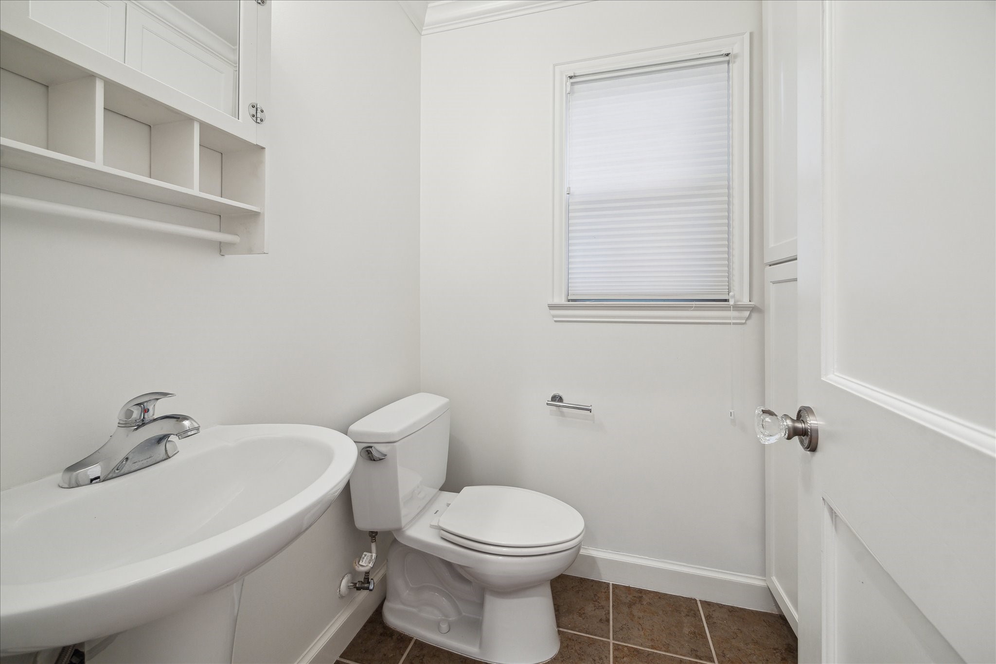 2117 Chilton Road Houston, TX 77019 - Photo 43 of 50 a white toilet sitting next to a bathroom sink