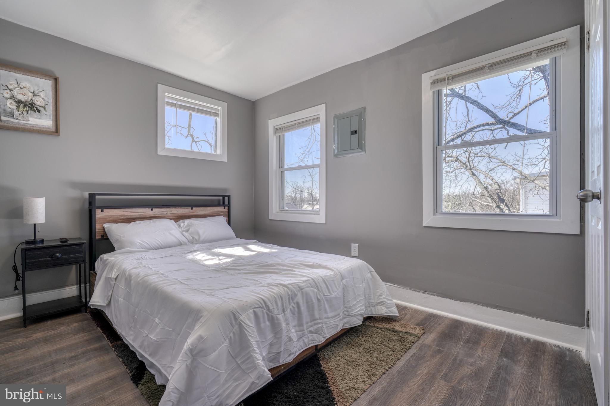 4107 Ridgewood Avenue Baltimore, MD 21215 - Photo 19 of 29 a bedroom with a bed and a window