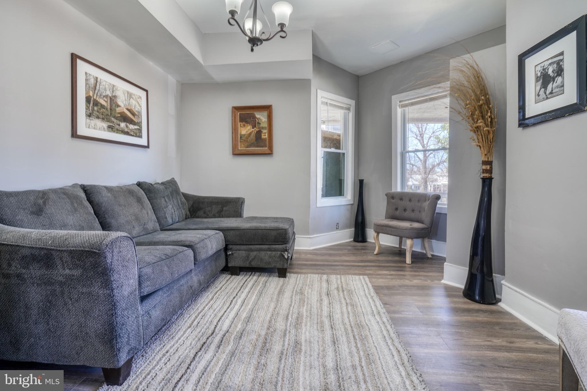 4107 Ridgewood Avenue Baltimore, MD 21215 - Photo 2 of 29 a living room with furniture and a wooden floor