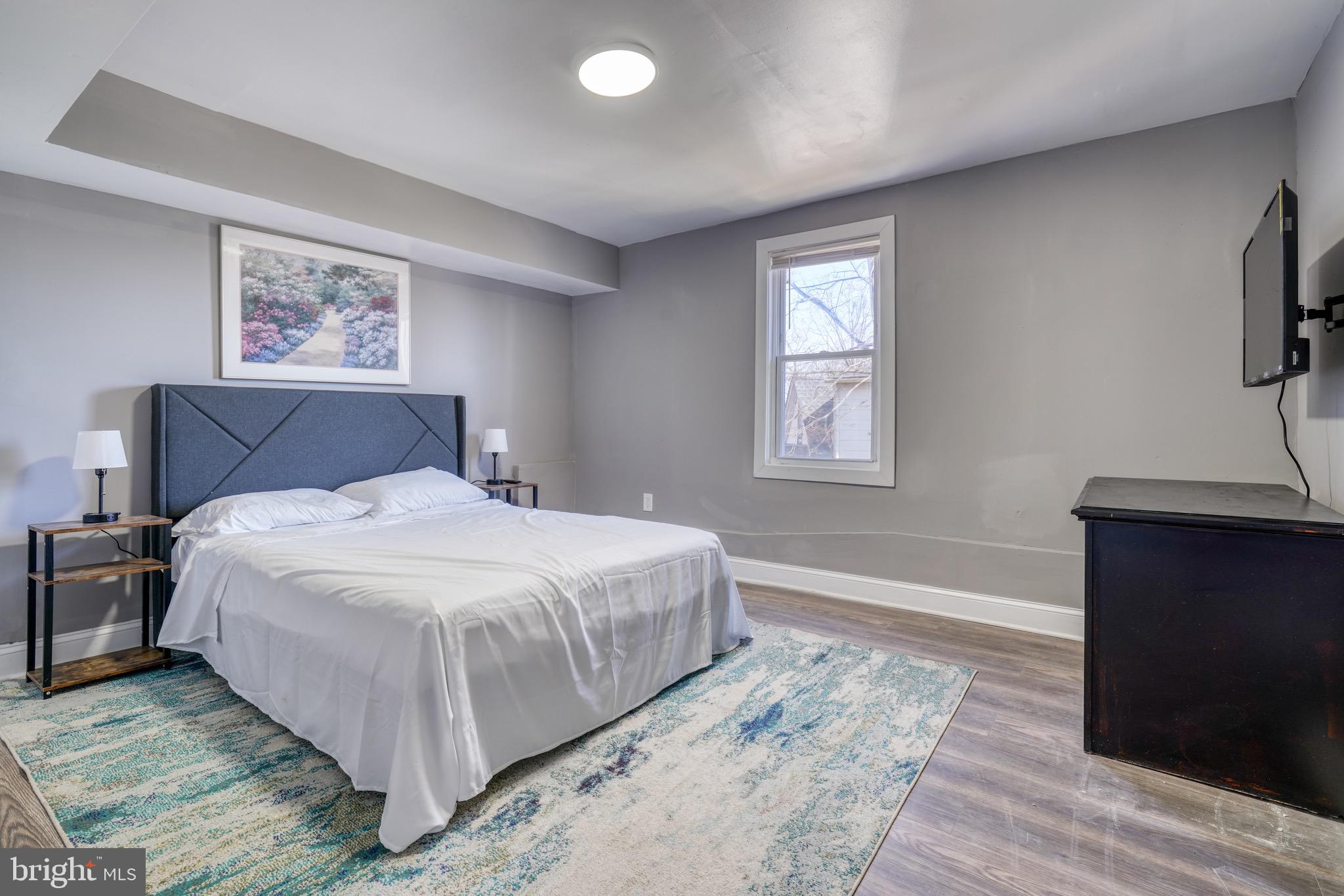 4107 Ridgewood Avenue Baltimore, MD 21215 - Photo 22 of 29 a bedroom with a bed and a window