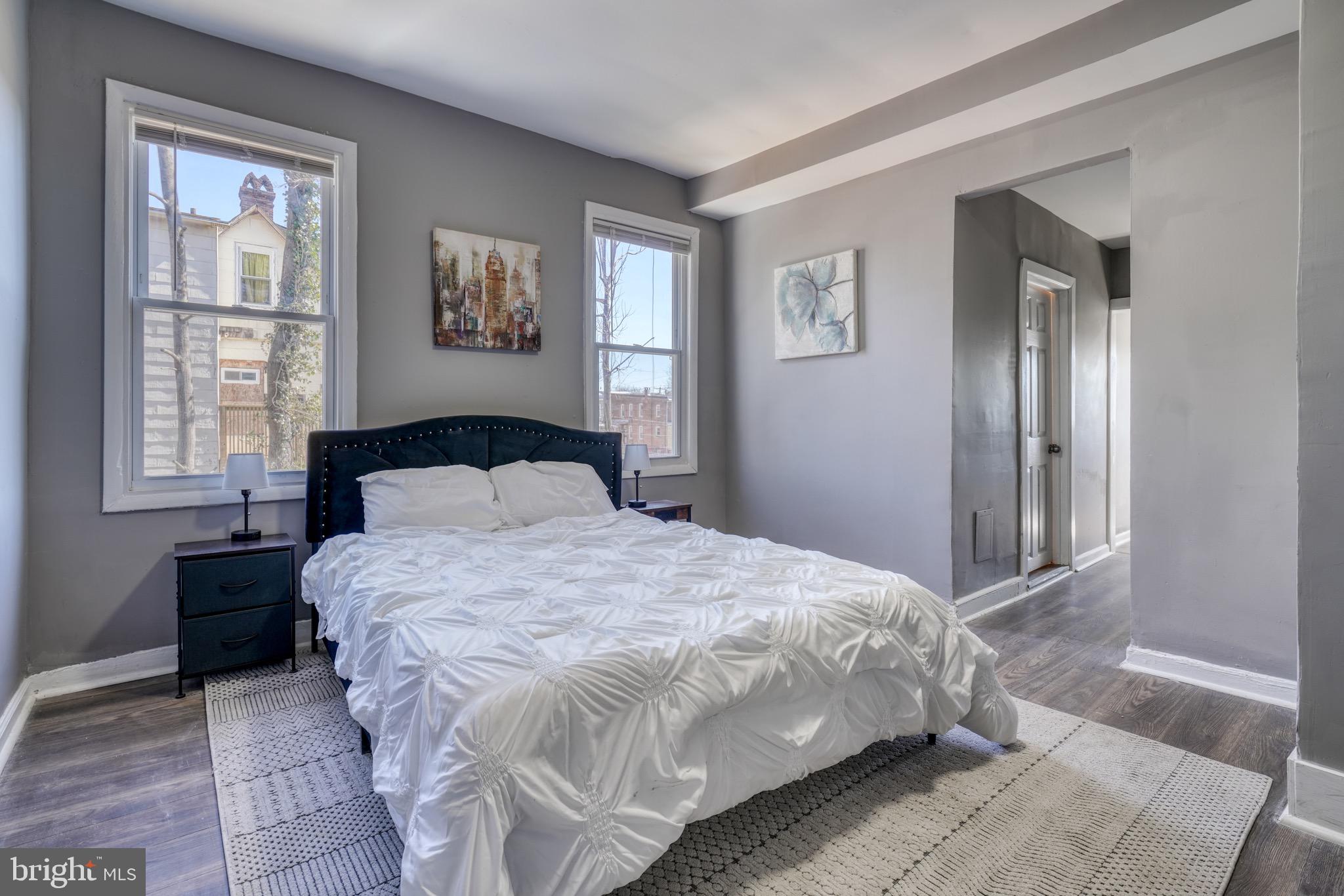 4107 Ridgewood Avenue Baltimore, MD 21215 - Photo 24 of 29 a bedroom with a large bed and a window
