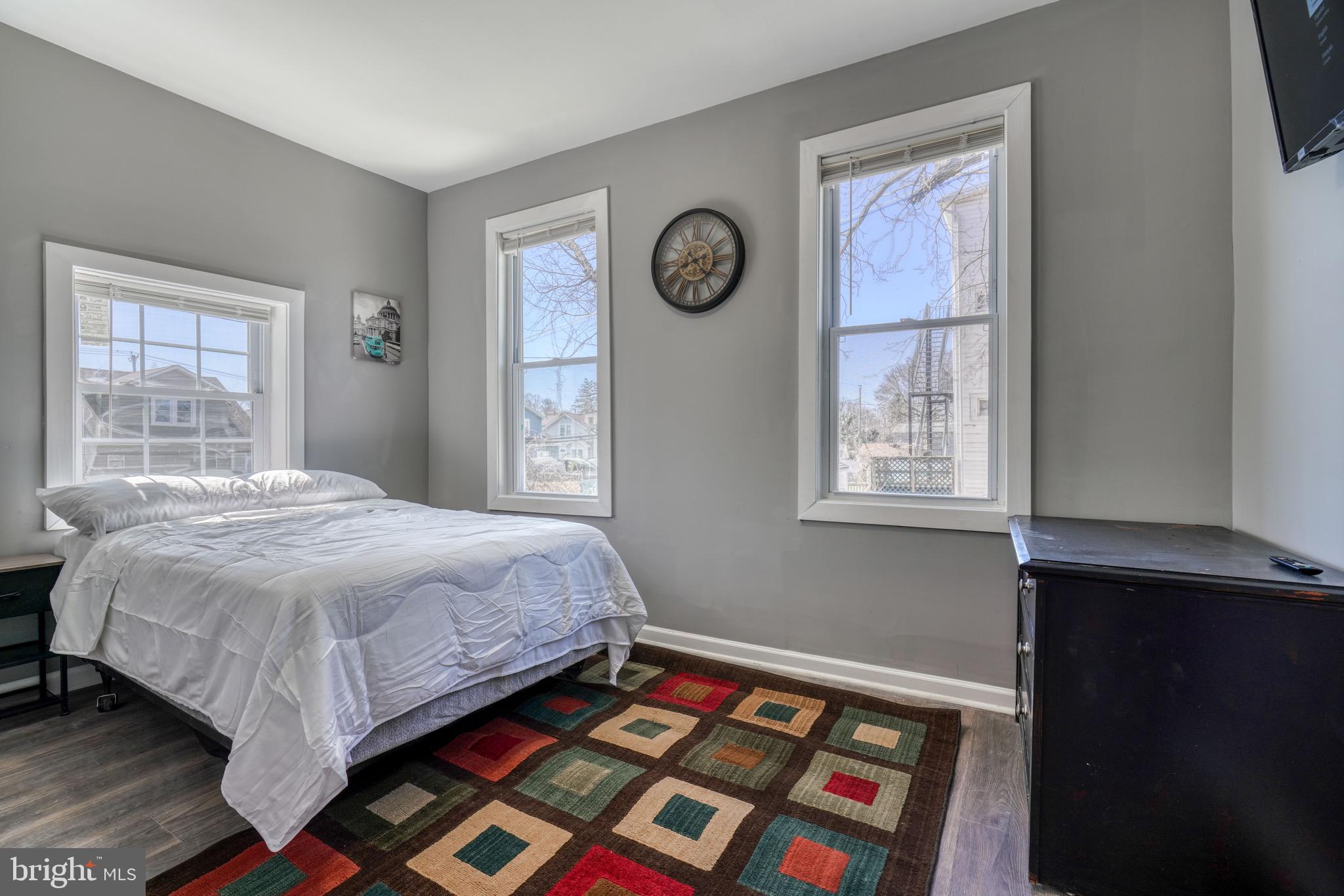 4107 Ridgewood Avenue Baltimore, MD 21215 - Photo 28 of 29 a bed sitting in a bedroom next to a window