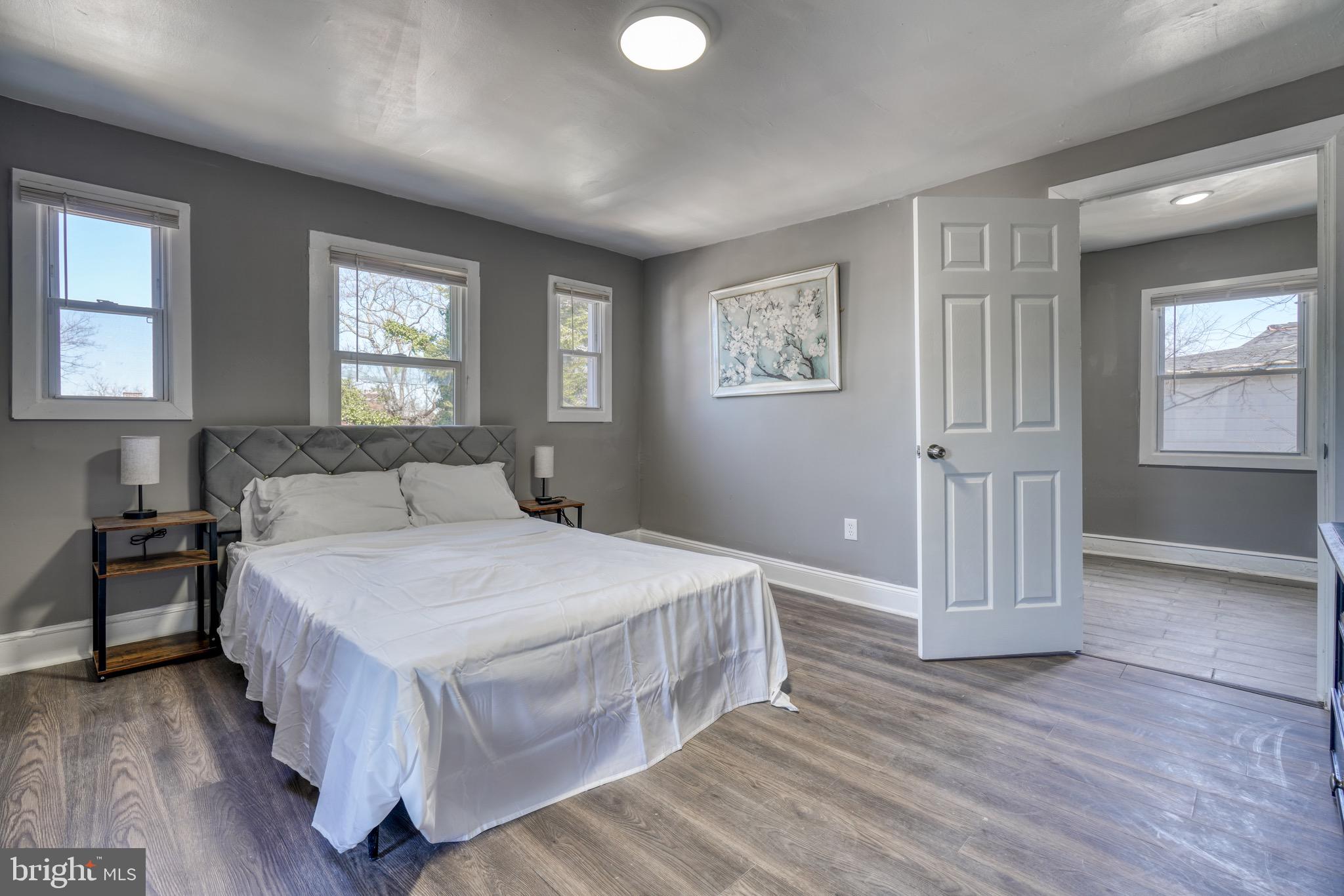 4107 Ridgewood Avenue Baltimore, MD 21215 - Photo 9 of 29 a spacious bedroom with a bed and a window