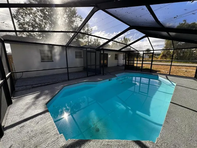 a view of a swimming pool with a porch