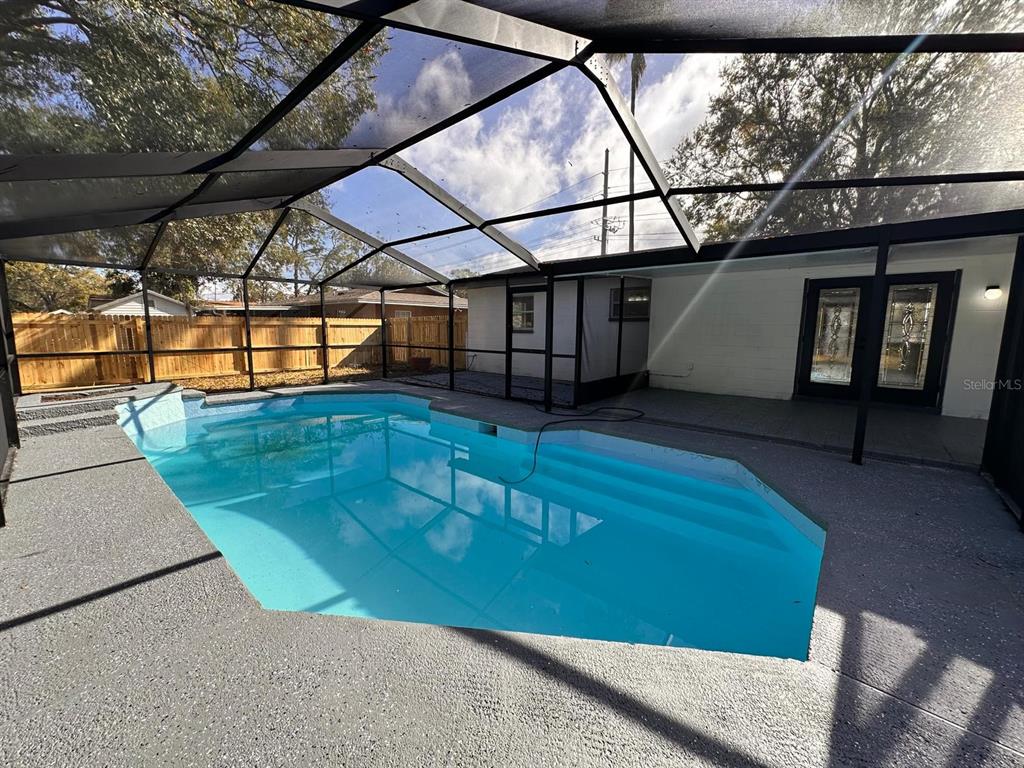 933 Windsor Street Lakeland, FL 33803 - Photo 44 of 47 a view of a swimming pool with a porch