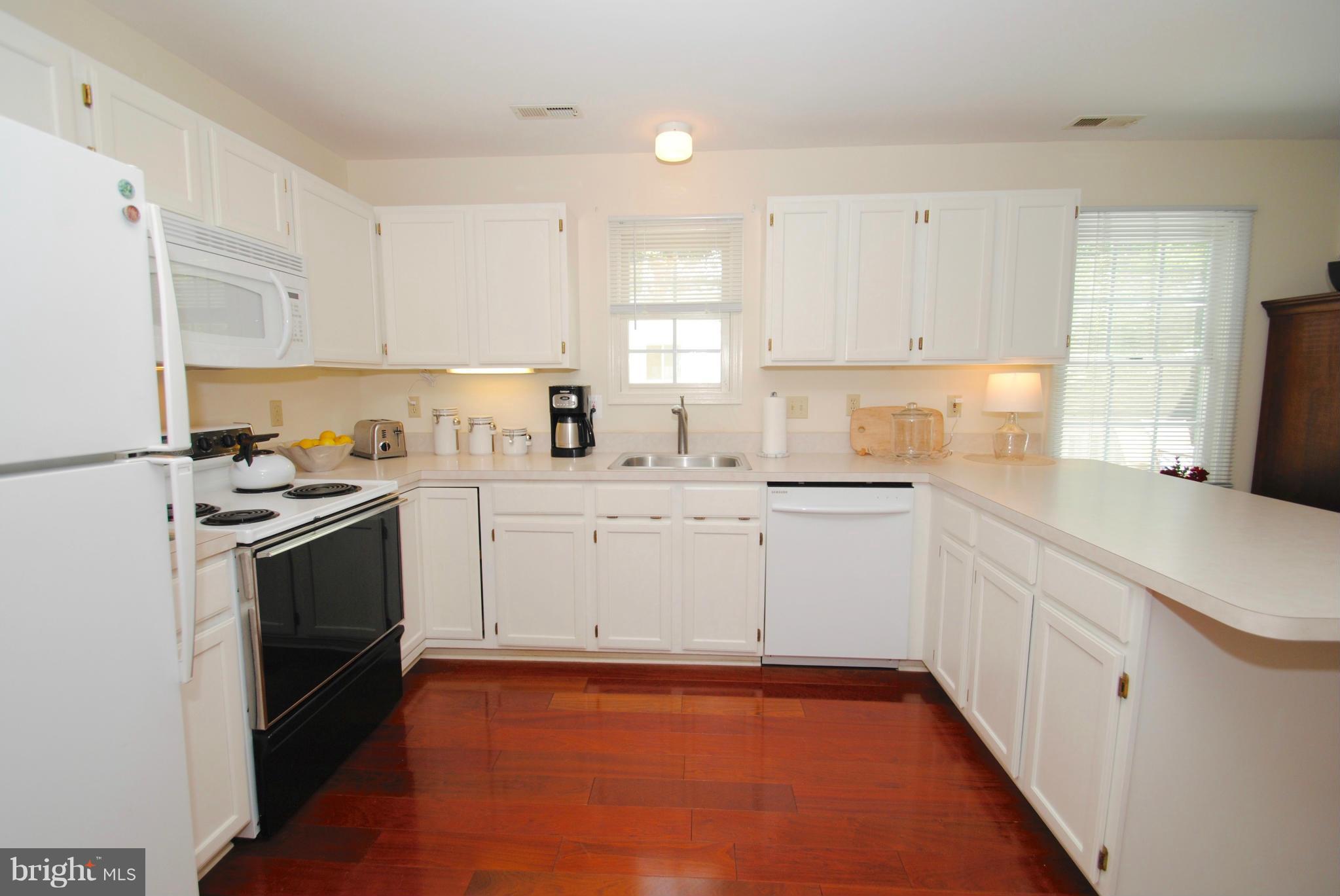 1531 Mayfield Road Edgewater, MD 21037 - Photo 7 of 26 a kitchen with granite countertop white cabinets and white appliances
