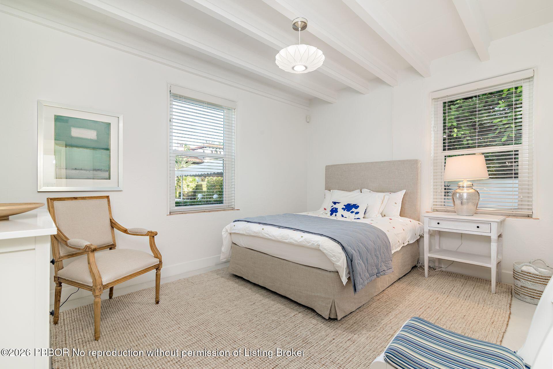 224 Churchill Road West Palm Beach, FL 33405 - Photo 16 of 33 a bedroom with a bed and a large window
