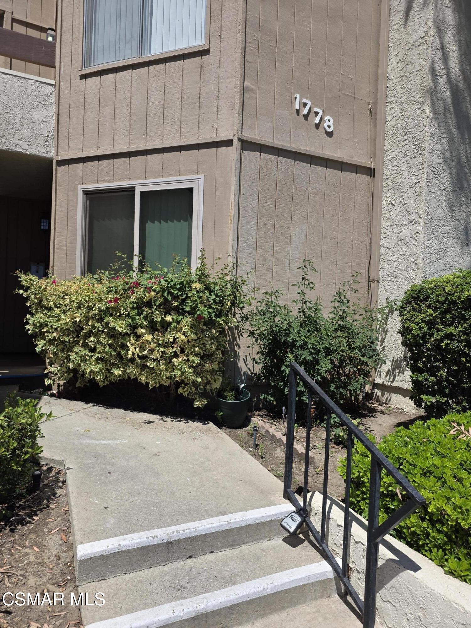 1778 Sinaloa Road, Unit 193 Simi Valley, CA 93065 - Photo 4 of 17 a view of a house with potted plants and wooden fence