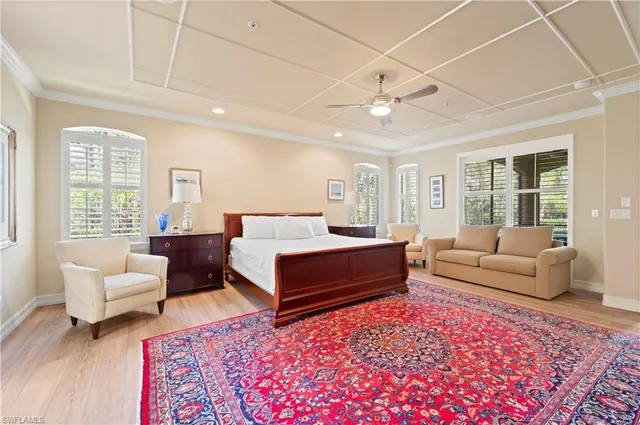 a bedroom with furniture and a rug