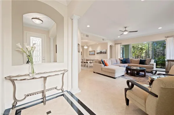 a living room with furniture and a table