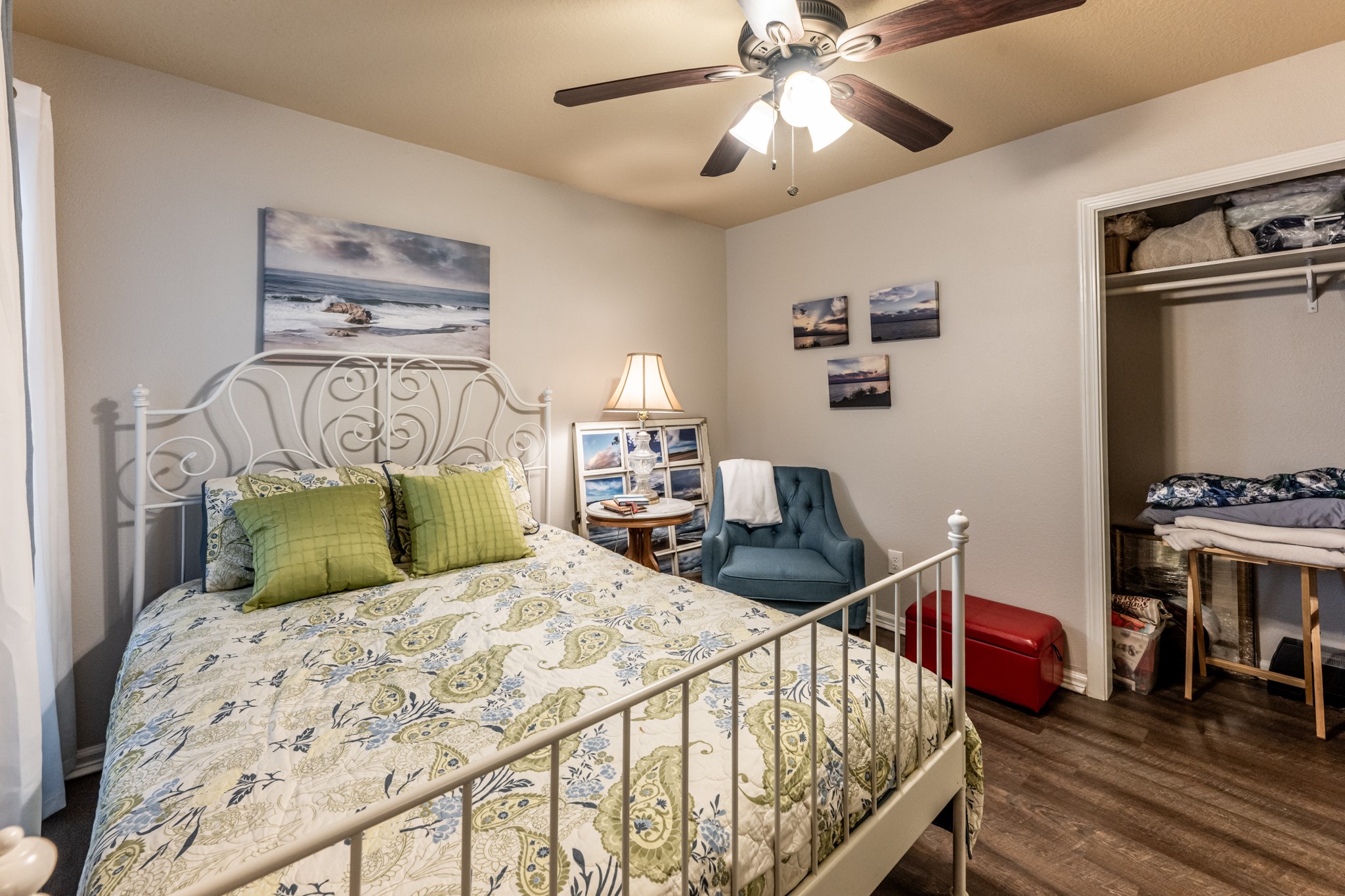 2115 Normal Park Drive Huntsville, TX 77340 - Photo 15 of 23 a bedroom with a bed and wooden floor