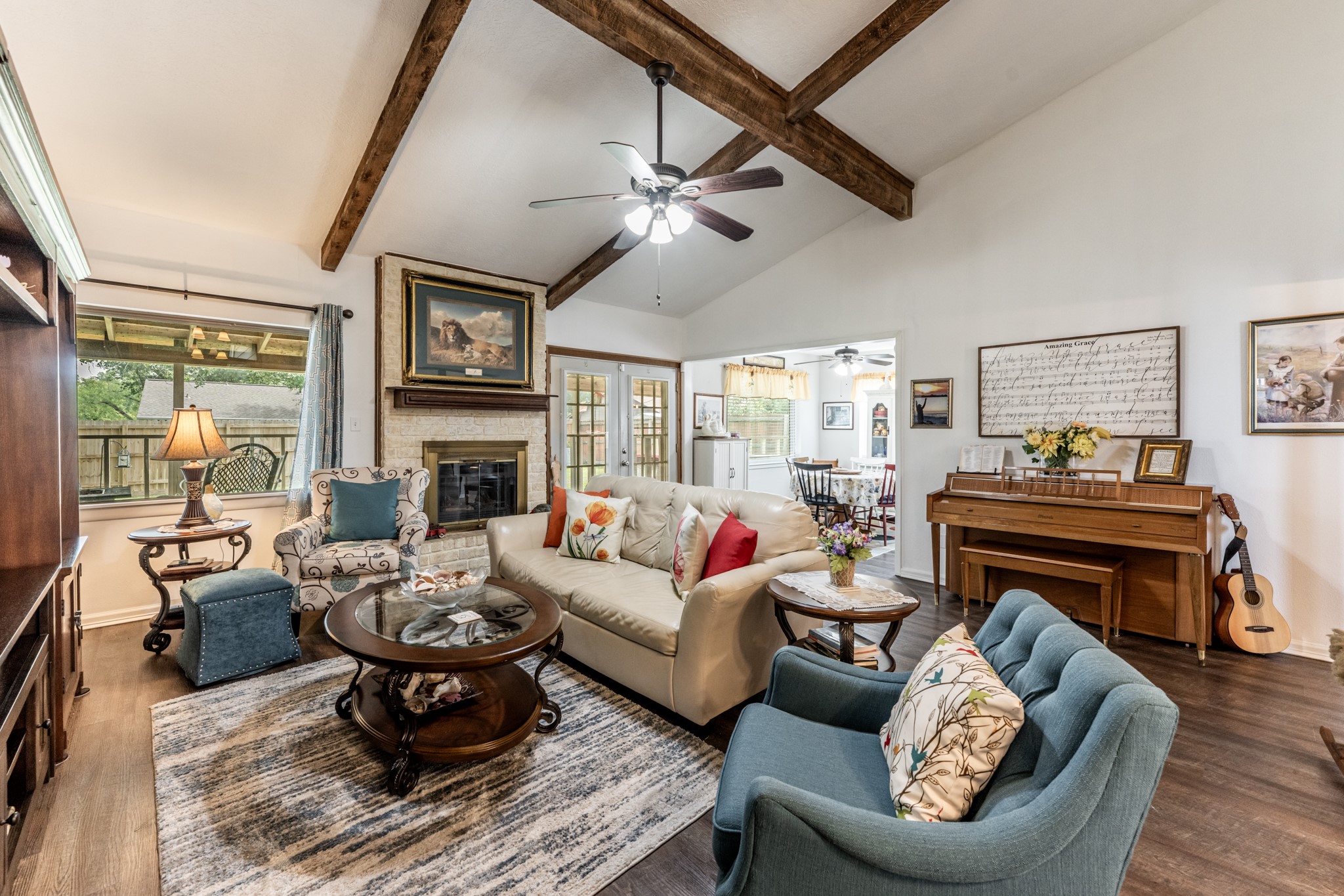 2115 Normal Park Drive Huntsville, TX 77340 - Photo 5 of 23 a living room with furniture a fireplace and a flat screen tv