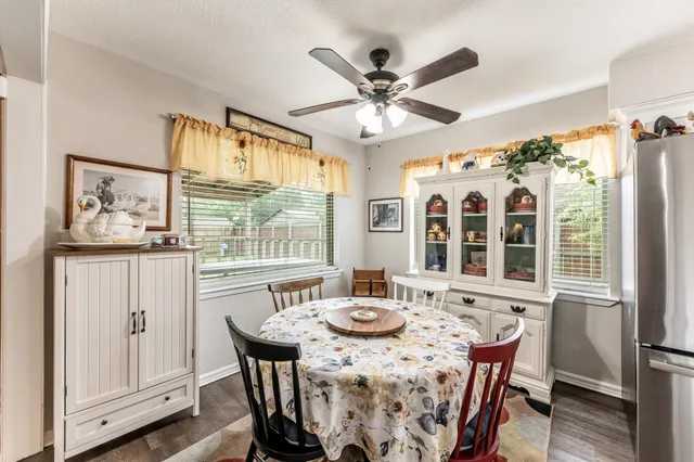 a view of a dining room with furniture window and outside view