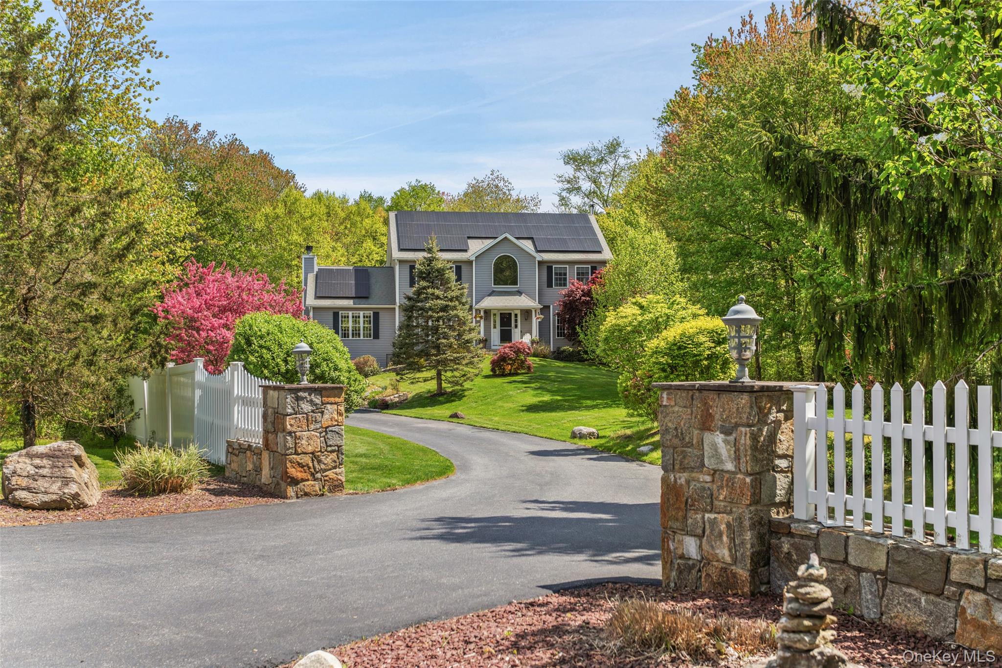 754 Milltown Road Danbury, CT 06811 - Photo 1 of 41 a front view of a house with a yard and a fence